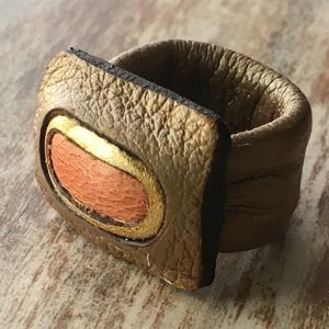 Metallic brown, gold & peach colored leather ring